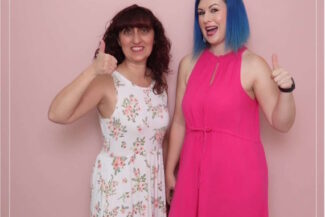 Makeup artist Diana (right, with blue hair) giving a thumbs up with the hairstylist at Strut Bridal Salon in Chandler, AZ, during a bridal beauty event focused on dewy wedding makeup trends