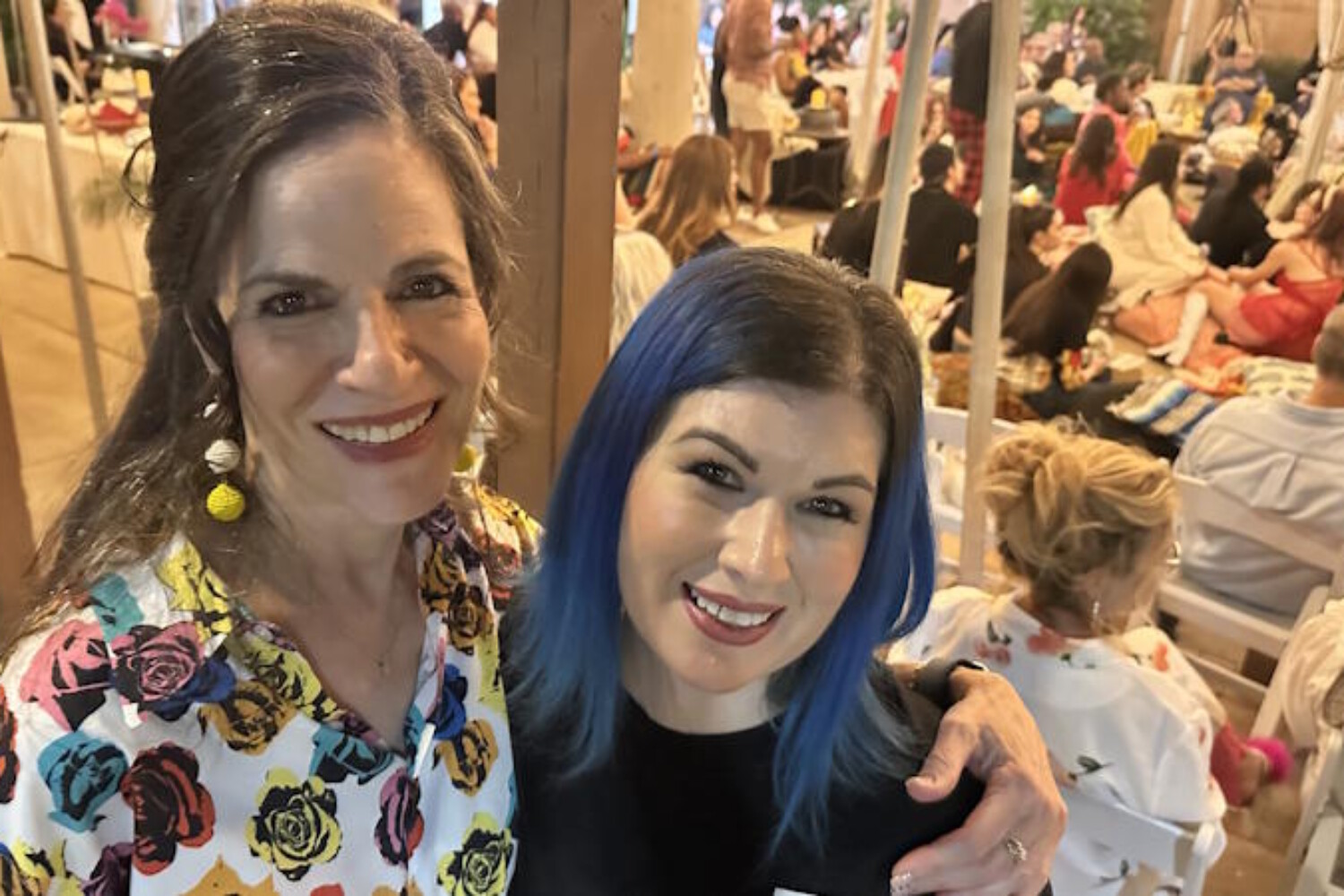 Professional makeup artist Diana at FABRIC’s 10th Anniversary fashion show in Tempe, Arizona, celebrating after creating 1950s runway looks.