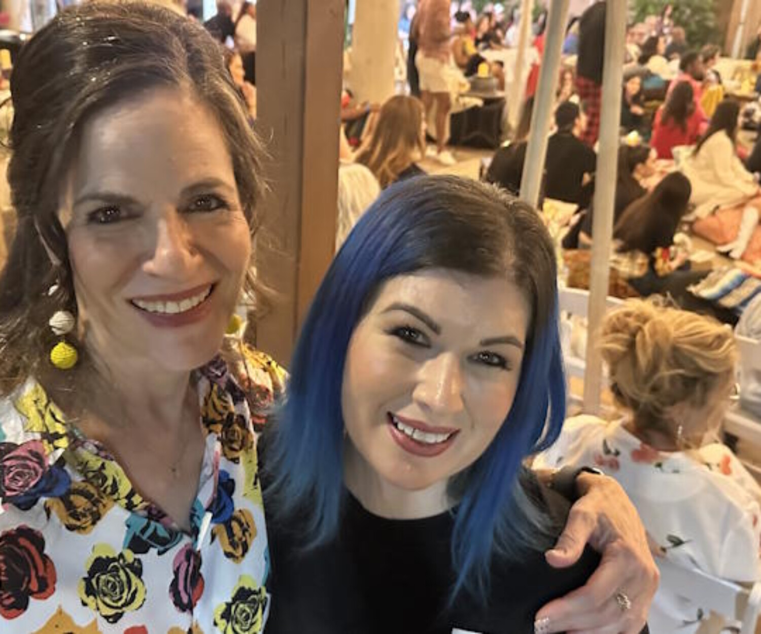 Professional makeup artist Diana at FABRIC’s 10th Anniversary fashion show in Tempe, Arizona, celebrating after creating 1950s runway looks.