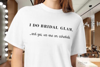 Makeup artist wearing a wedding‑day bridal glam shirt in a professional salon setting – DiGlamWedCo beauty professional attire.