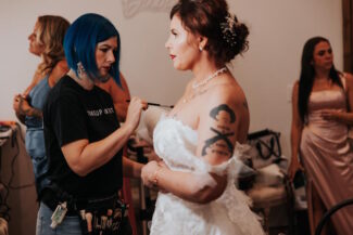 Arizona bridal makeup artist Diana applying wedding day makeup to a bride getting ready in Chandler