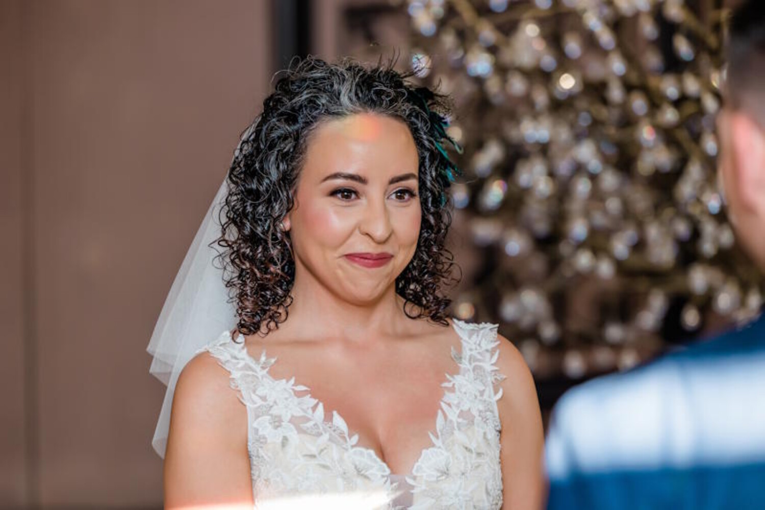 Bride in a lace wedding gown sharing a quiet moment with her groom during their wedding day, professionally photographed in Arizona.