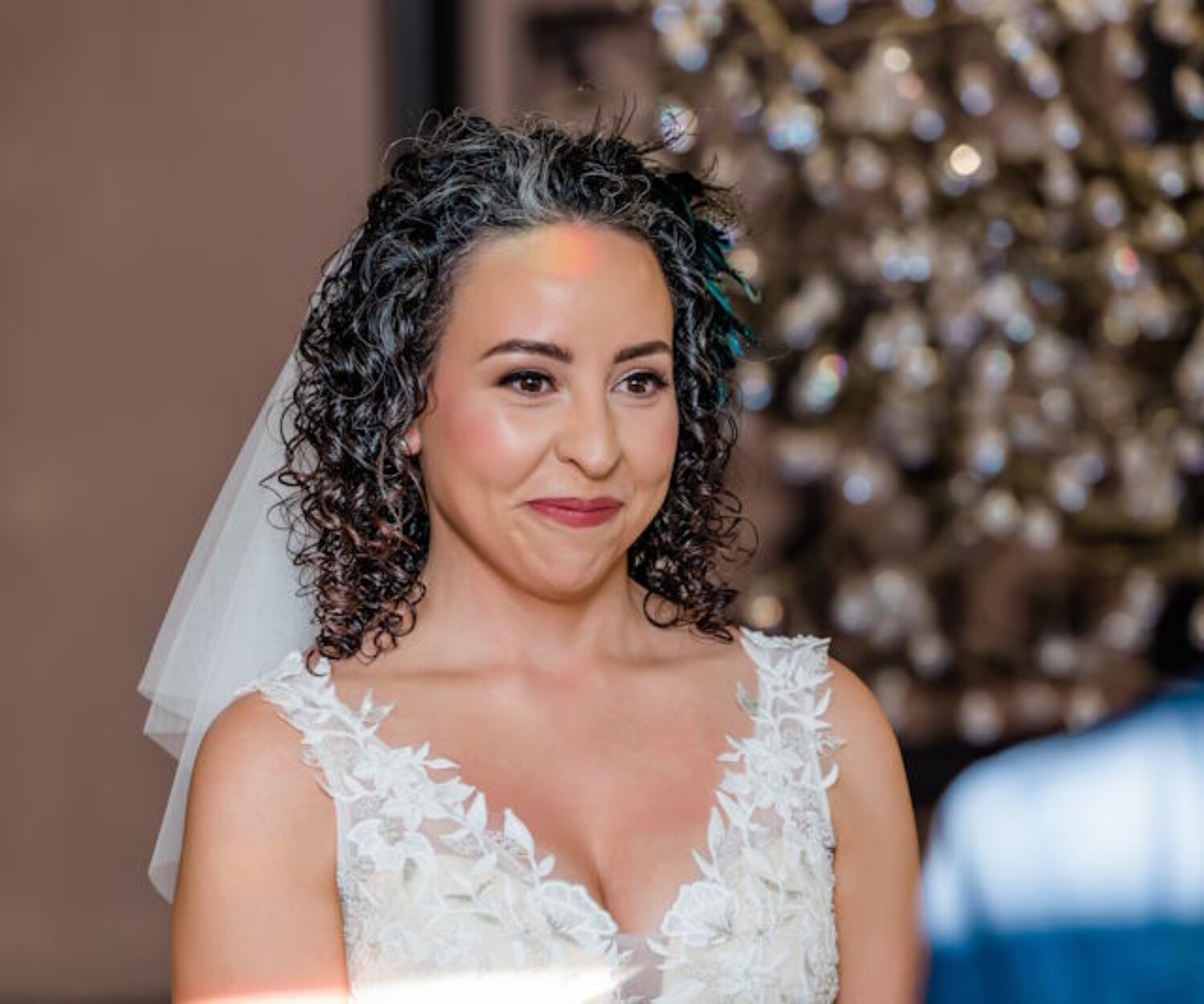 Bride in a lace wedding gown sharing a quiet moment with her groom during their wedding day, professionally photographed in Arizona.