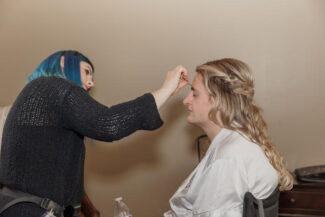 Bride sitting calmly during her wedding morning makeup with a bridal makeup artist in Chandler AZ — Makeup by Diana